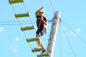 Here is a child on the high ropes course at SMC.